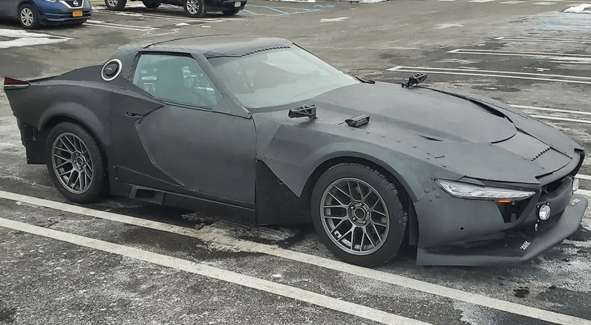 Real-world cyberpunk custom build inspired by Cyberpunk 2077 – asymmetrical panels, exposed mechanics, glowing LED strips, and dystopian paint on a modified sports car