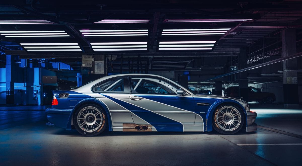Side profile of BMW E46 M3 GTR replica in iconic silver-blue NFS Most Wanted livery.