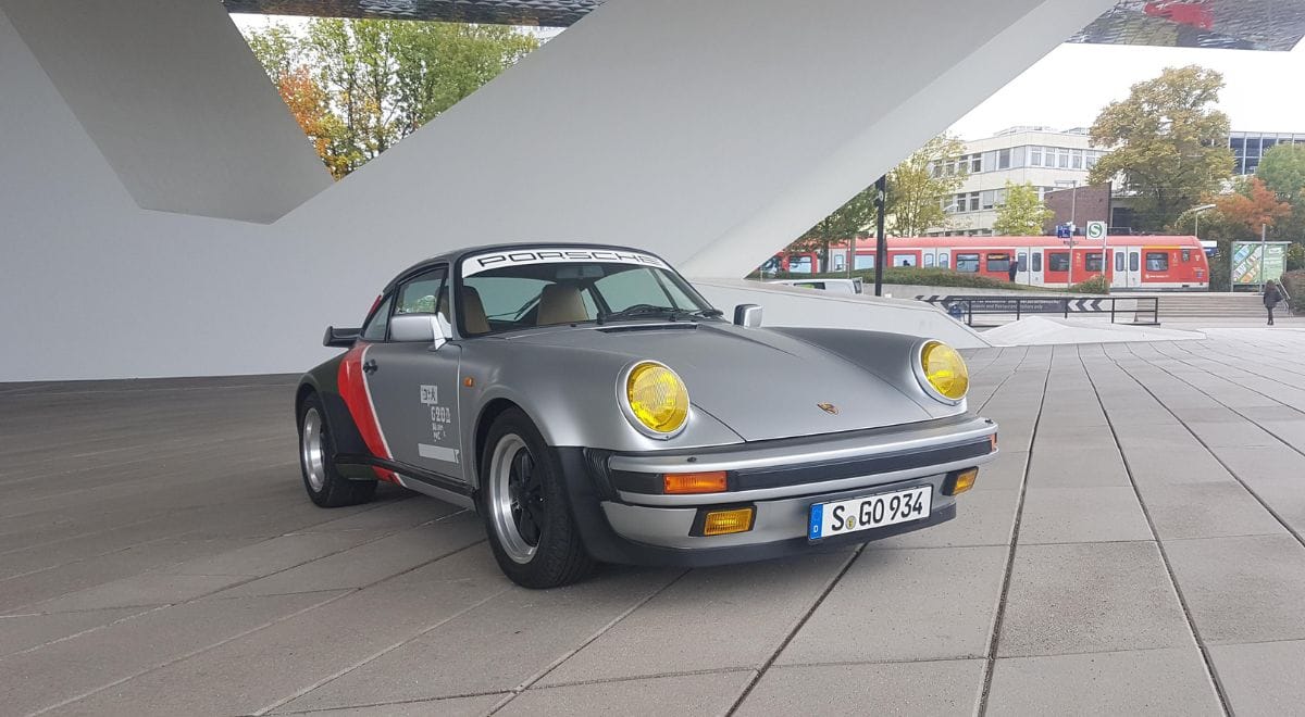 Johnny Silverhand's 1970s Porsche 911 Turbo from Cyberpunk 2077 – raw analog chrome beast with neon accents and lowered stance, the rockerboy ride that lives in real garages