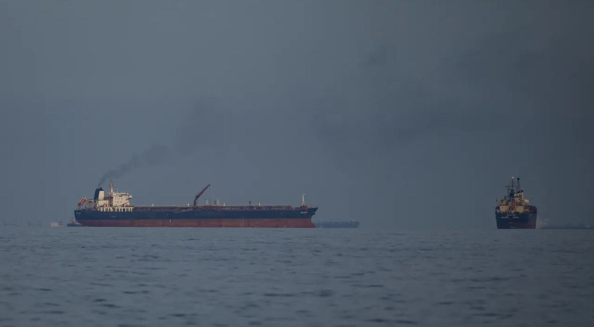 Two oil tankers navigating rough waters in the Strait of Hormuz