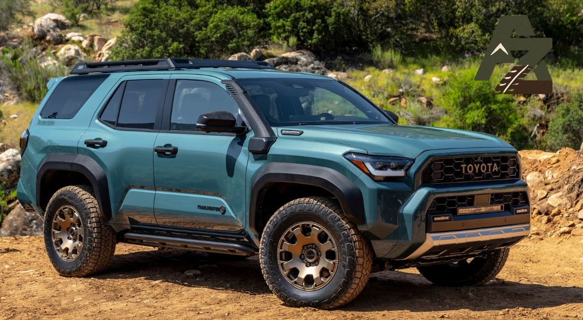 2025 Toyota 4Runner Trailhunter parked on a rugged mountain trail with bronze wheels and off-road gear.