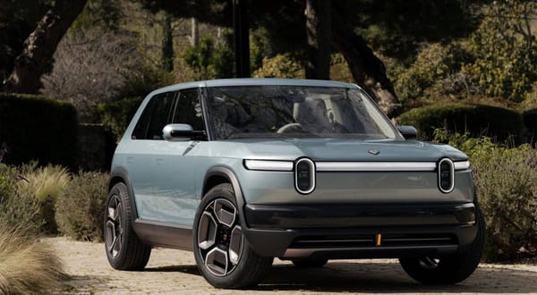 Rivian R3 and R3X compact electric SUVs displayed together, showcasing their off-road design and sleek body lines.